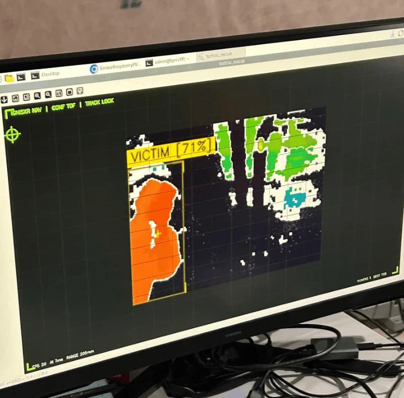 Ember's HUD showing a thermal view with a detected body outlined and labelled VICTIM 71%.