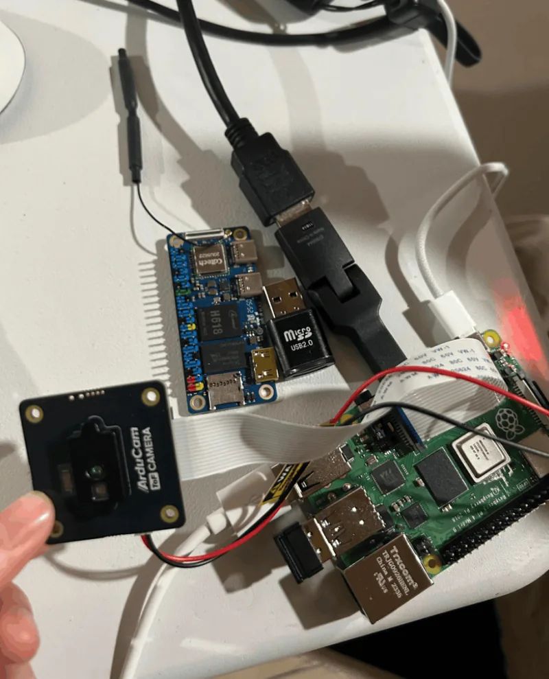 An ArduCam time-of-flight camera module wired to a Raspberry Pi and a single-board compute module.